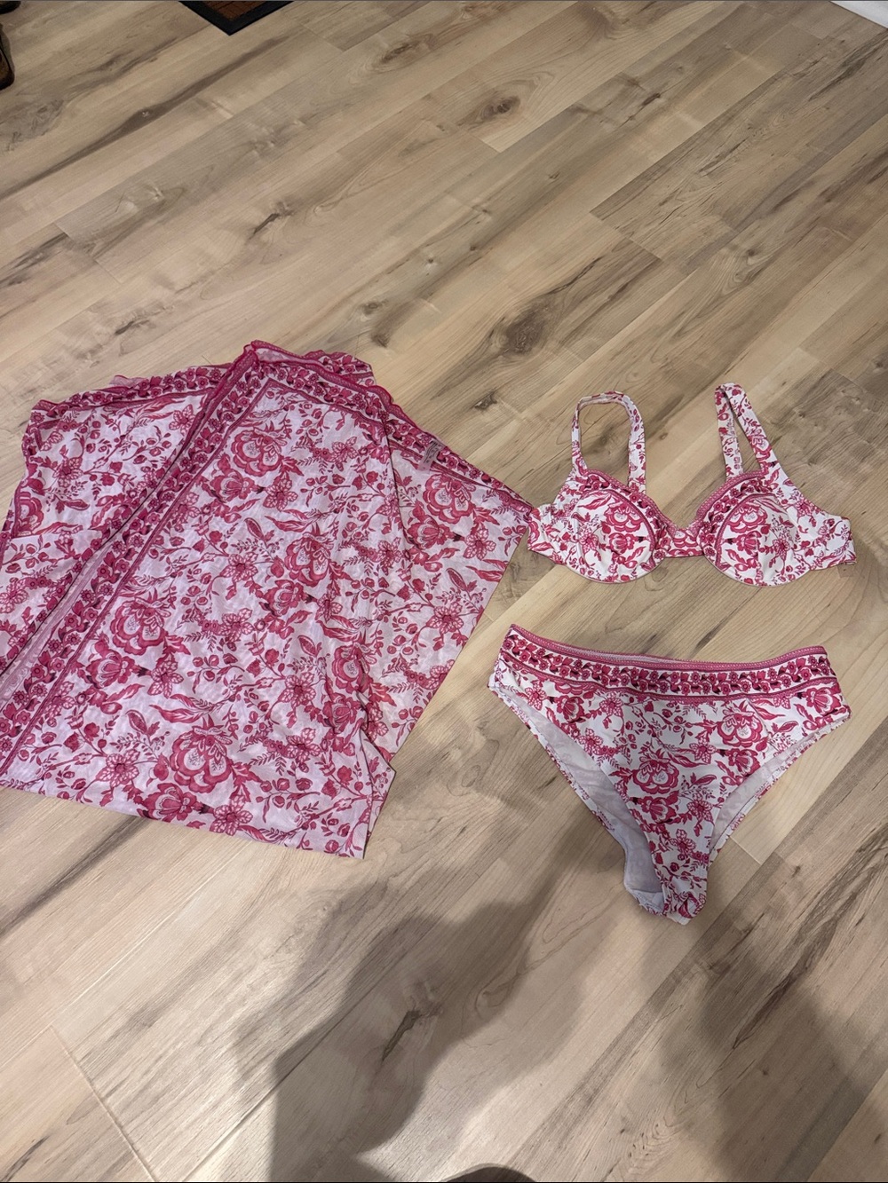 size large pink patterned bikini set with skirt that ties.